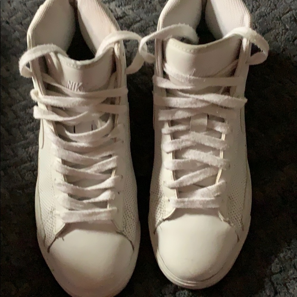 High top white Nike’s.